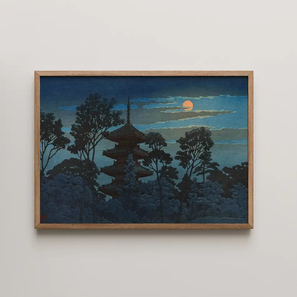 Hasui Kawase woodblock print of Ikegami Honmonji, a pagoda silhouetted among dark trees beneath a pale glowing sun in a deep blue evening sky.