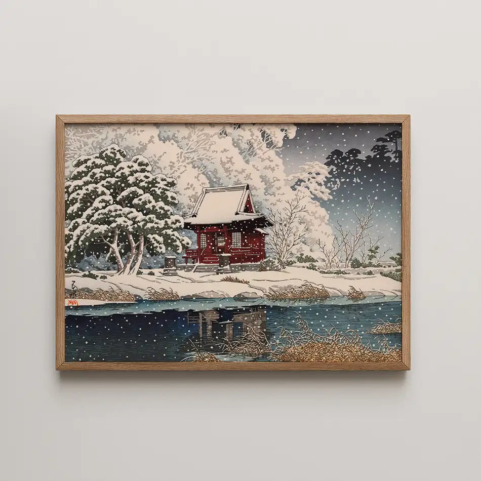 Hasui Kawase woodblock print of Snow at Benten Shrine Entrance, a small red shrine building framed by heavily snow laden trees beside dark water.