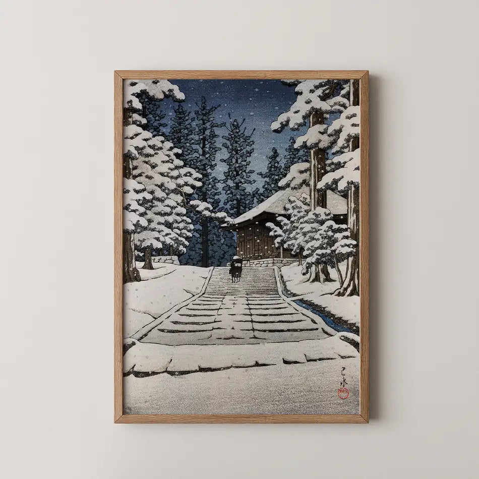 Hasui Kawase woodblock print of Konjikido in Hiraizumi, a snow covered stairway climbing between cedar trees as a figure with an umbrella ascends.