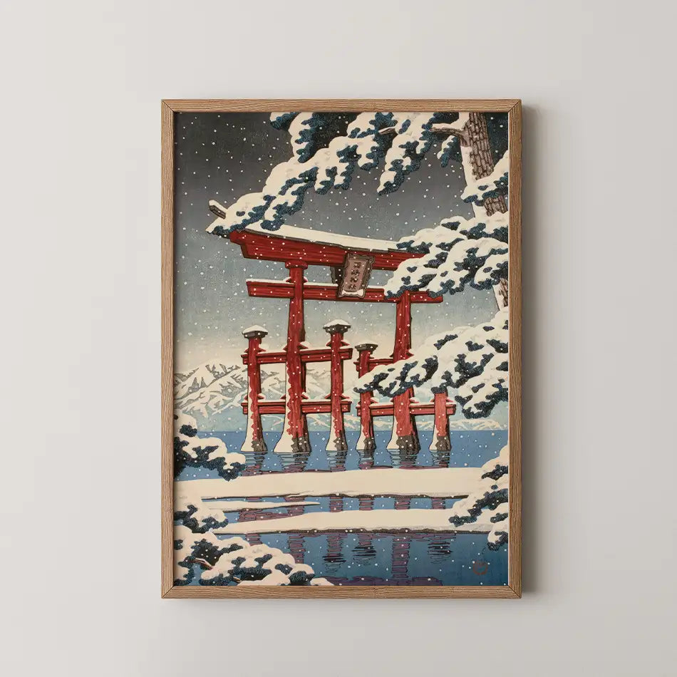 Hasui Kawase woodblock print of Miyajima in snow, waterfront houses and a snow laden pine beside a jetty with two moored boats.