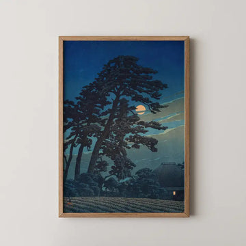 Hasui Kawase woodblock print of the moon at Magome, a towering pine silhouette half covering the moon above a small lit farmhouse.