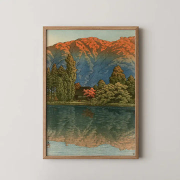 Hasui Kawase woodblock print of Morning at Ao Marsh, Ura Heights, an autumn mountain ridge in red and gold reflected in still water.