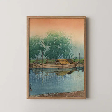 Hasui Kawase woodblock print of Morning at Tsuchiura, a moored houseboat beneath a weeping willow reflected in calm water at dawn.