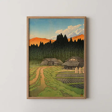 Hasui Kawase woodblock print of Nakayama Plain, Miyagi Prefecture, thatched farmhouses before dark cedars and autumn coloured hills.