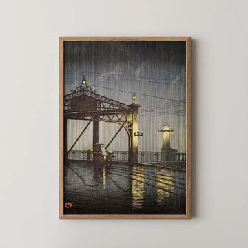Hasui Kawase woodblock print of Shinohashi Bridge at night, an iron truss bridge lit by lampposts with a rickshaw sheltering below in the rain.