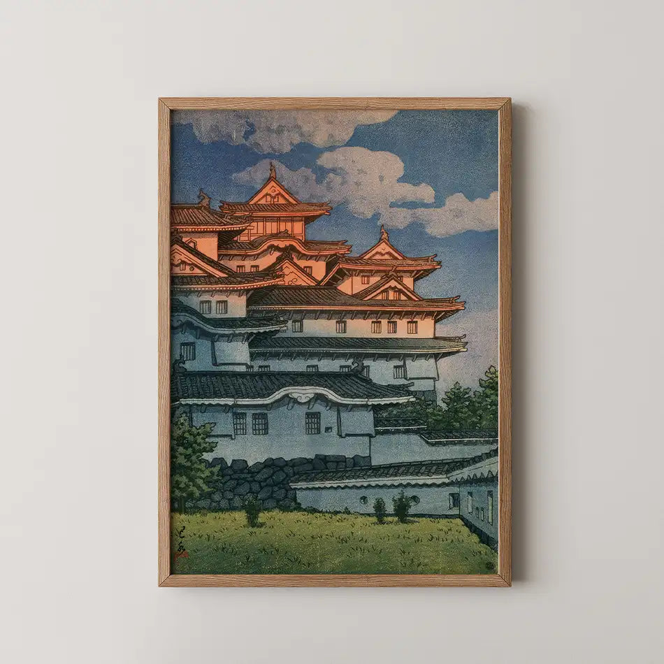 Hasui Kawase woodblock print of Shirasagi Castle, Himeji Castle's white tiered walls and dark roofs under a blue sky with clouds.