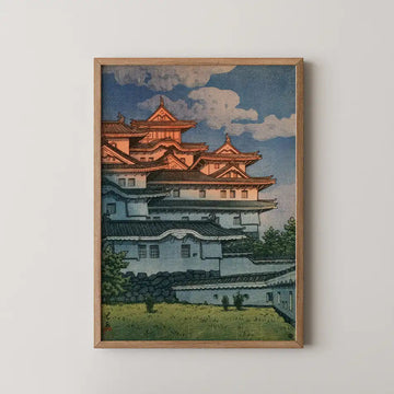 Hasui Kawase woodblock print of Shirasagi Castle, Himeji Castle's white tiered walls and dark roofs under a blue sky with clouds.