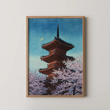 Hasui Kawase woodblock print of Toshogu pagoda in Ueno at evening, rising through cherry blossom beneath a crescent moon.