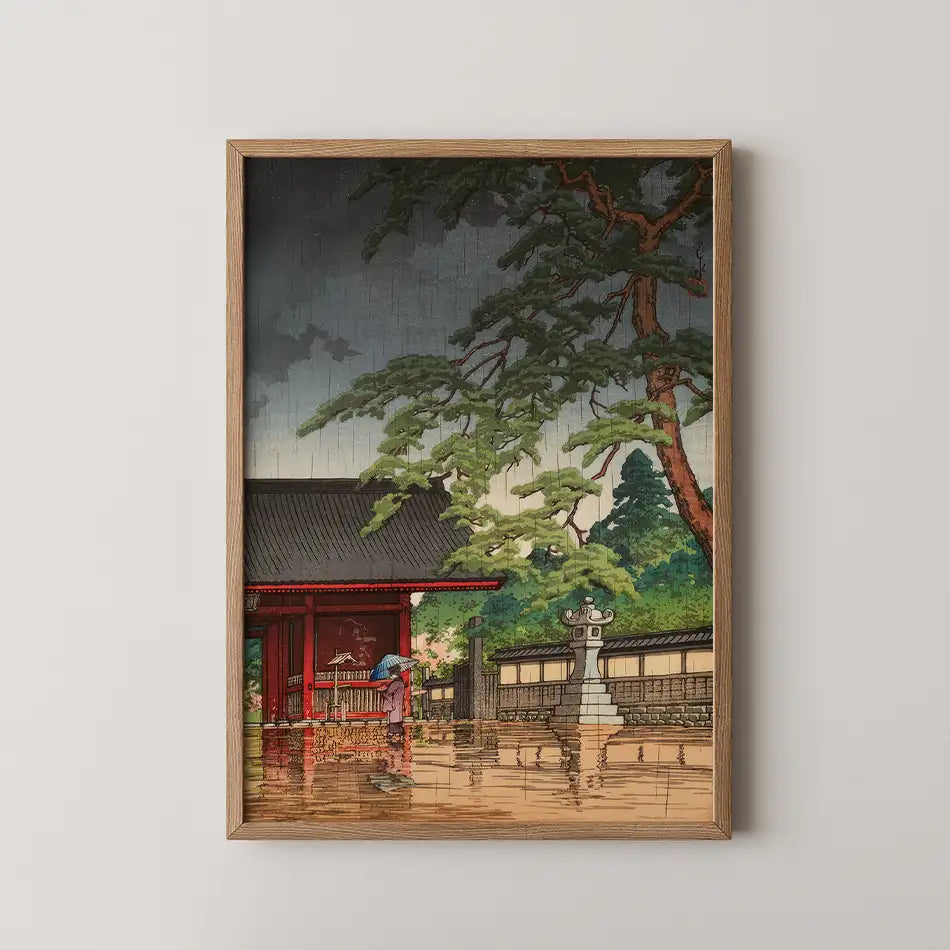 Hasui Kawase woodblock print of Spring Rain at Gokokuji, a red temple gate beneath a large pine as a figure with an umbrella passes through rain.