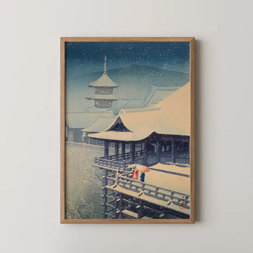 Hasui Kawase woodblock print of Spring Snow at Kiyomizu Temple, two figures with umbrellas crossing a snow dusted veranda as the pagoda rises through falling snow.