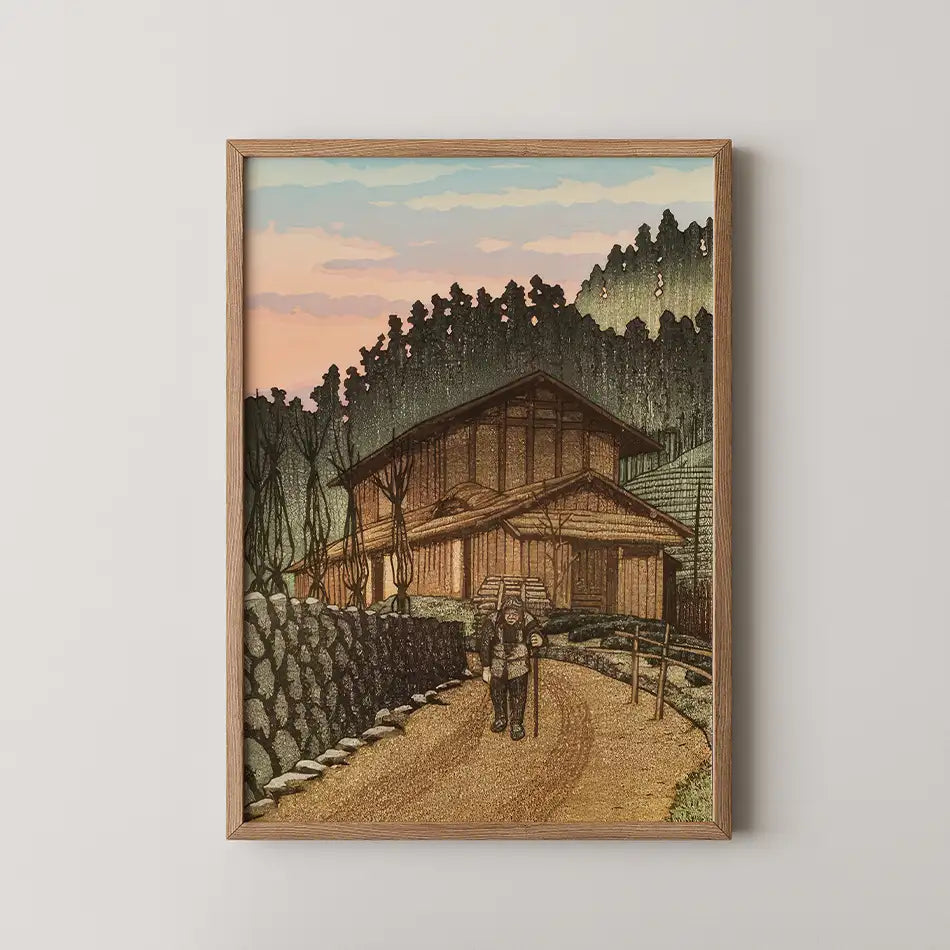Hasui Kawase woodblock print of a thatched farmhouse among cedar trees at Nenoyama, Saitama, with a traveller walking the road at sunset.