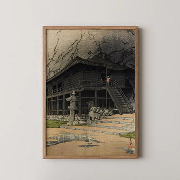 Hasui Kawase woodblock print of Tatsuyakutsu at Hiraizumi, a wooden temple built into a rock cave with two figures crossing its stairway.