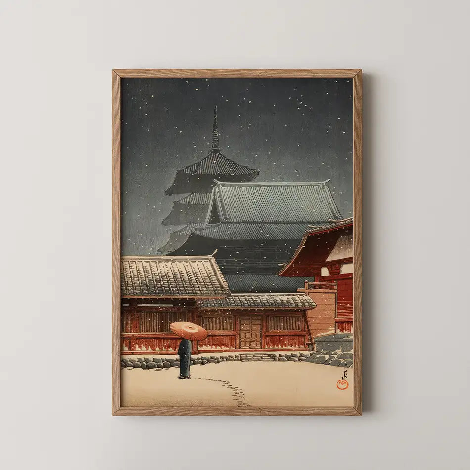 Hasui Kawase woodblock print of Tennoji Temple in Osaka at night, snow falling over a five story pagoda while a figure crosses the courtyard under a red umbrella.