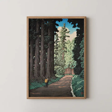 Hasui Kawase woodblock print of the ancient cedar avenue leading to Nikko, a lone traveller walking the stone road beneath towering trees.
