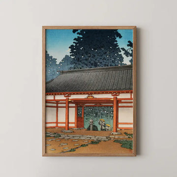 Hasui Kawase woodblock print of Tsubosaka Temple, Yamato, a heavy tiled gate roof with two travellers resting beside a stone lantern at dusk.