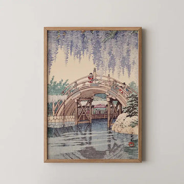 Hasui Kawase woodblock print of Wisteria at Kameido, a curved wooden bridge beneath cascading purple wisteria above a still pond.