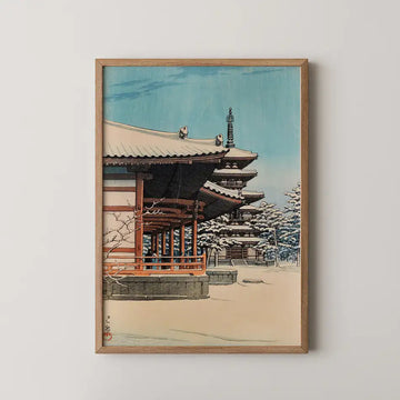 Hasui Kawase woodblock print of Yakushiji Temple in Nara, a snow covered walkway and distant pagoda under a clear winter sky.