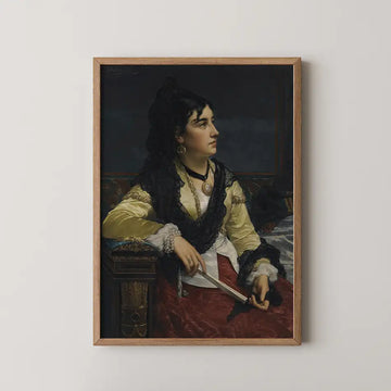 Portrait of a woman in a yellow blouse and black shawl, holding a pair of scissors, framed and displayed on a white wall.