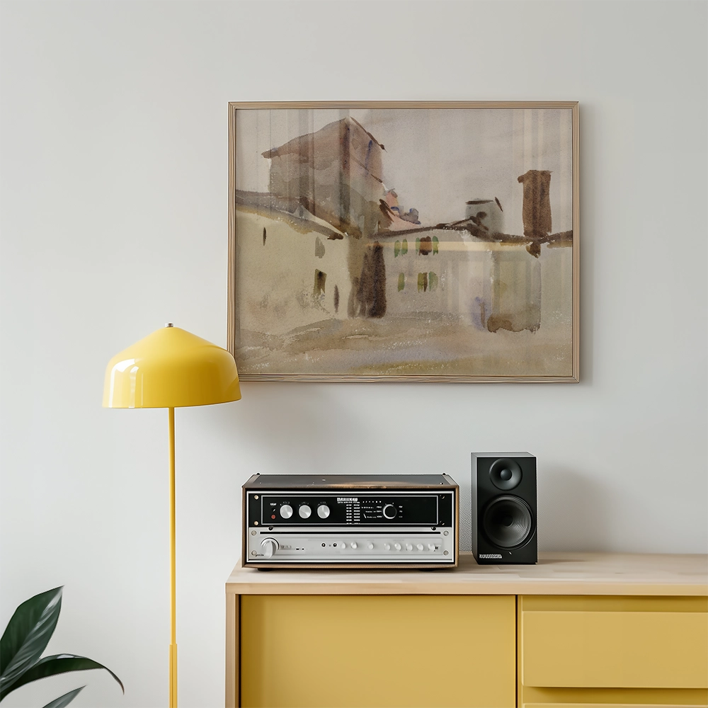 Watercolor painting of a building displayed above a vintage audio system and a yellow floor lamp in a modern interior setting.