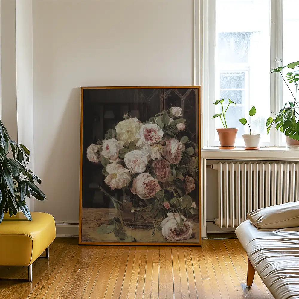 Painting of a vase filled with pink and white roses displayed in a cozy, modern interior setting with plants and wooden flooring.