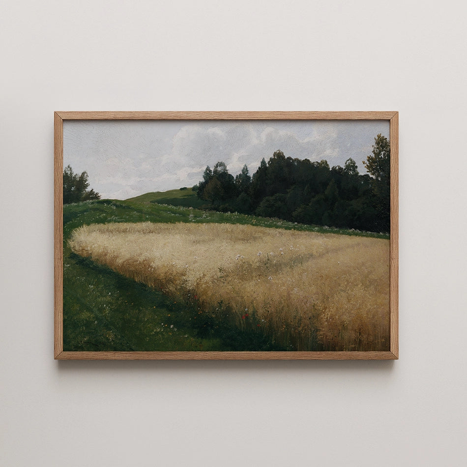 Framed painting of a scenic landscape featuring golden fields, green hills, and a cloudy sky.