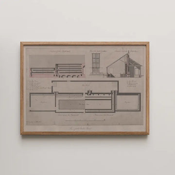 Architectural blueprint artwork framed in wood, featuring detailed drawings of building layouts and sections in muted tones.