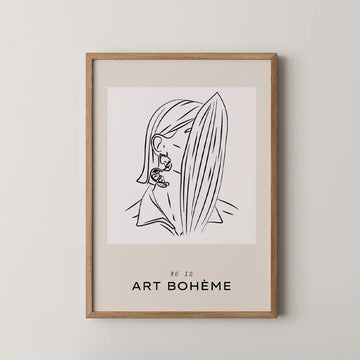 Minimalist line art print of a woman with flowing hair, elegantly framed in a wooden frame, perfect for modern home décor.