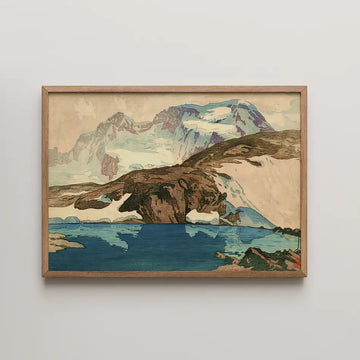 Framed painting of a mountain landscape with a blue lake and snow-capped peaks.