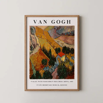 Vincent van Gogh painting titled Valley With Ploughman Seen From Above, a patchwork of ploughed fields around a red roofed farmhouse on a hillside.