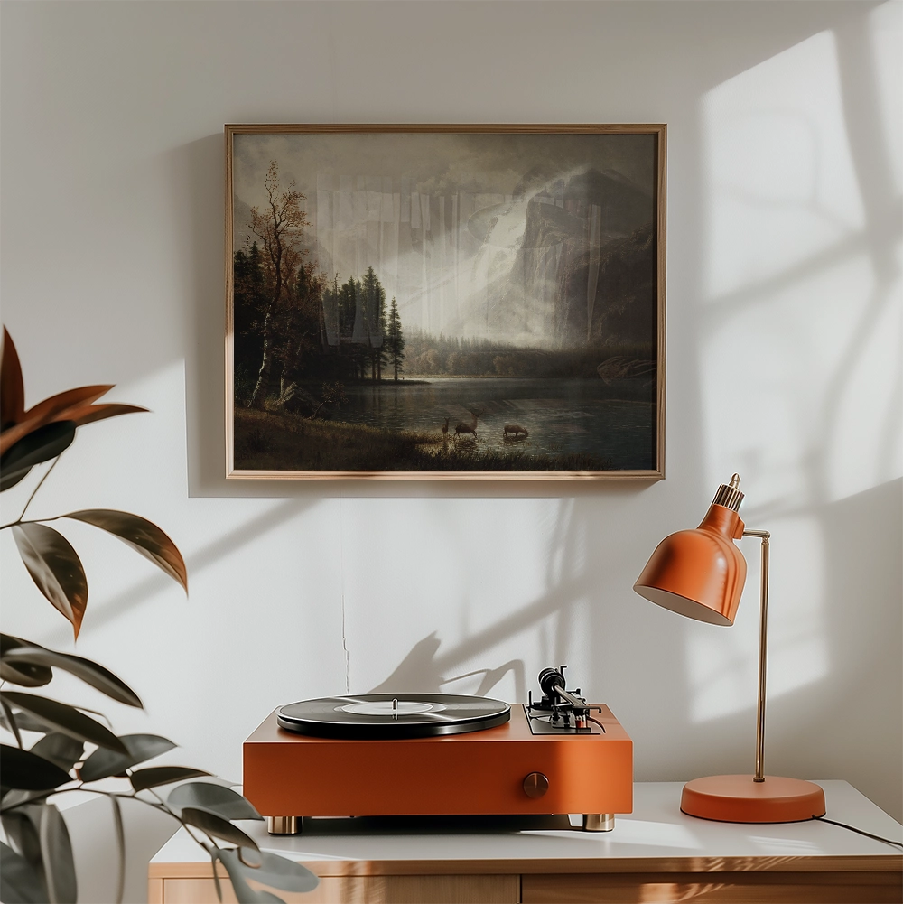 A vintage landscape painting depicting a serene lake surrounded by trees, framed and hung above an orange record player and matching lamp in a sunlit interior setting.