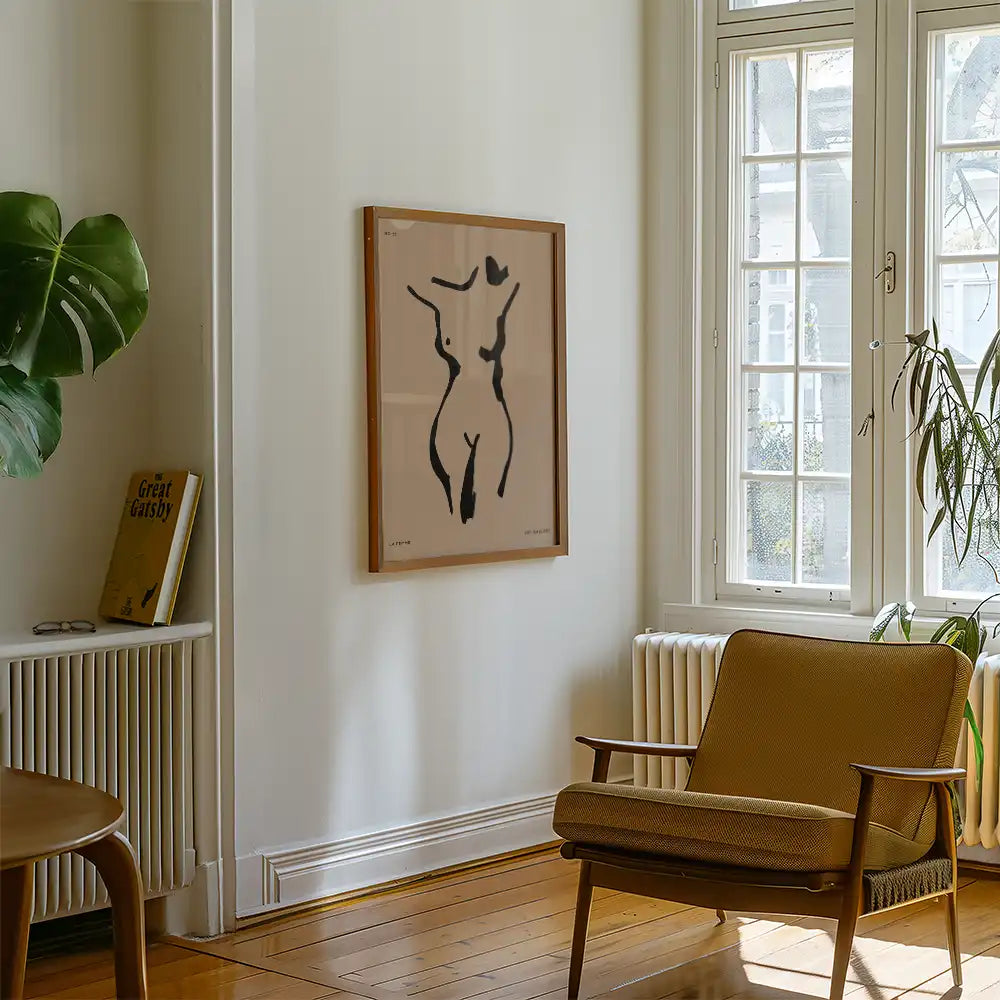 Modern reprint of a famous abstract painting featuring a minimalist silhouette of a female form, elegantly displayed in a stylish living room setting.