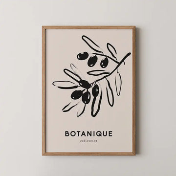 "Elegant botanical art print of an olive branch in black ink on a washed beige background from the Bohemian Collection, framed in wood."