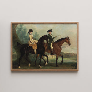 Painting of two horse riders, one wearing a cream outfit and the other in a dark green coat, framed in wood, with a landscape background featuring a house and trees.