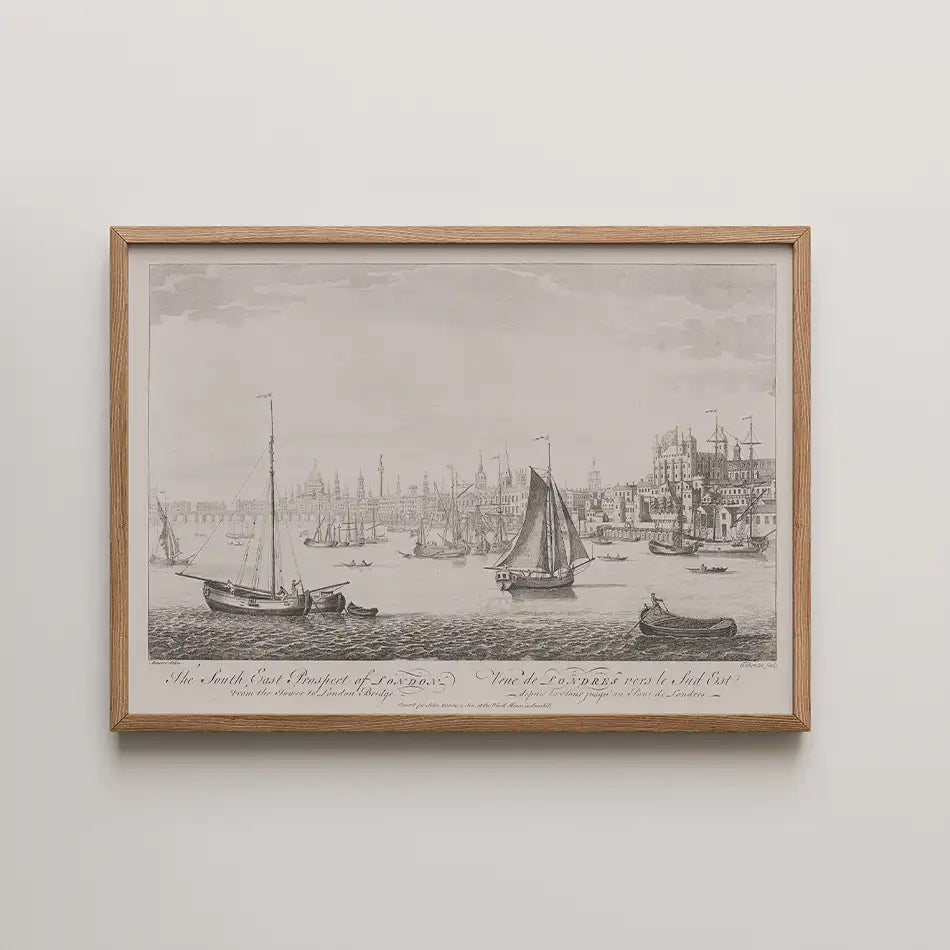 Historic black and white illustration of the southeast view of London featuring various sailing boats on the river, framed in a Oak wood frame.