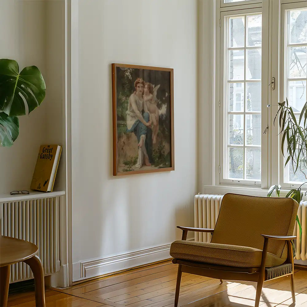 Framed painting of a woman sitting with a child and a small dog, displayed in a bright, cozy living room with a green plant and a bookshelf.