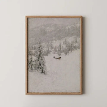Framed painting of a snowy landscape featuring trees and a figure pulling a sled in winter scenery.