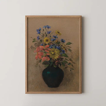 A vibrant painting of a bouquet of flowers in a dark vase, featuring yellow, blue, and pink blossoms, framed in wood against a neutral background.