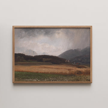 Anton Hlavacek landscape painting titled Rainy Mood over Igls, showing a golden wheat field under a heavy storm sky above an alpine village.