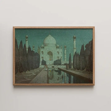 Hiroshi Yoshida woodblock print of the Taj Mahal by night, glowing pale blue under a teal starry sky above its reflecting pool.