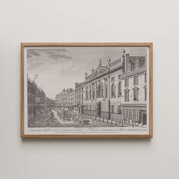 Framed black and white vintage engraving of a street scene featuring historical architecture and horse-drawn carriages.