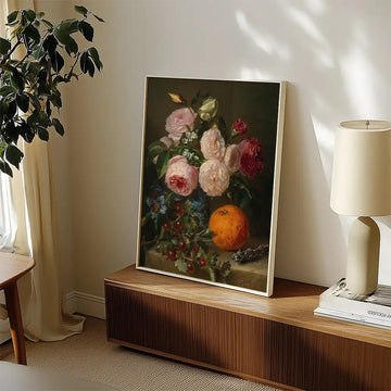Still life painting of flowers and an orange displayed in a modern living space.