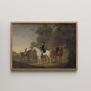 Framed painting featuring two riders on horseback in a picturesque landscape with hounds, depicting a serene hunting scene.