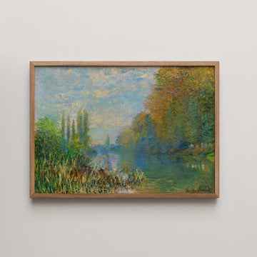 Framed impressionist painting of a serene river landscape with greenery and autumn trees.