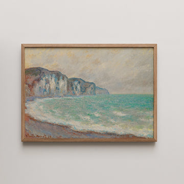 Framed painting of a serene seascape featuring rocky cliffs and gentle waves under a cloudy sky.