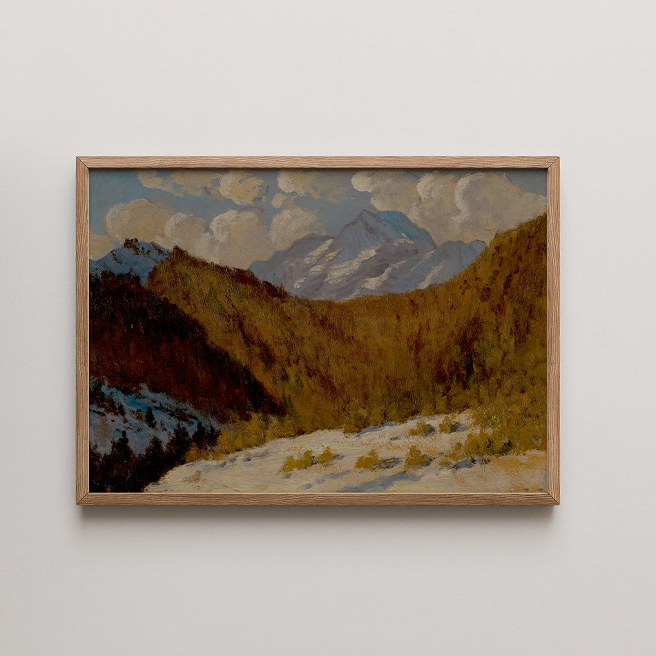 Mountain landscape painting in a wooden frame, featuring autumn foliage and snow-capped peaks under a cloudy sky.