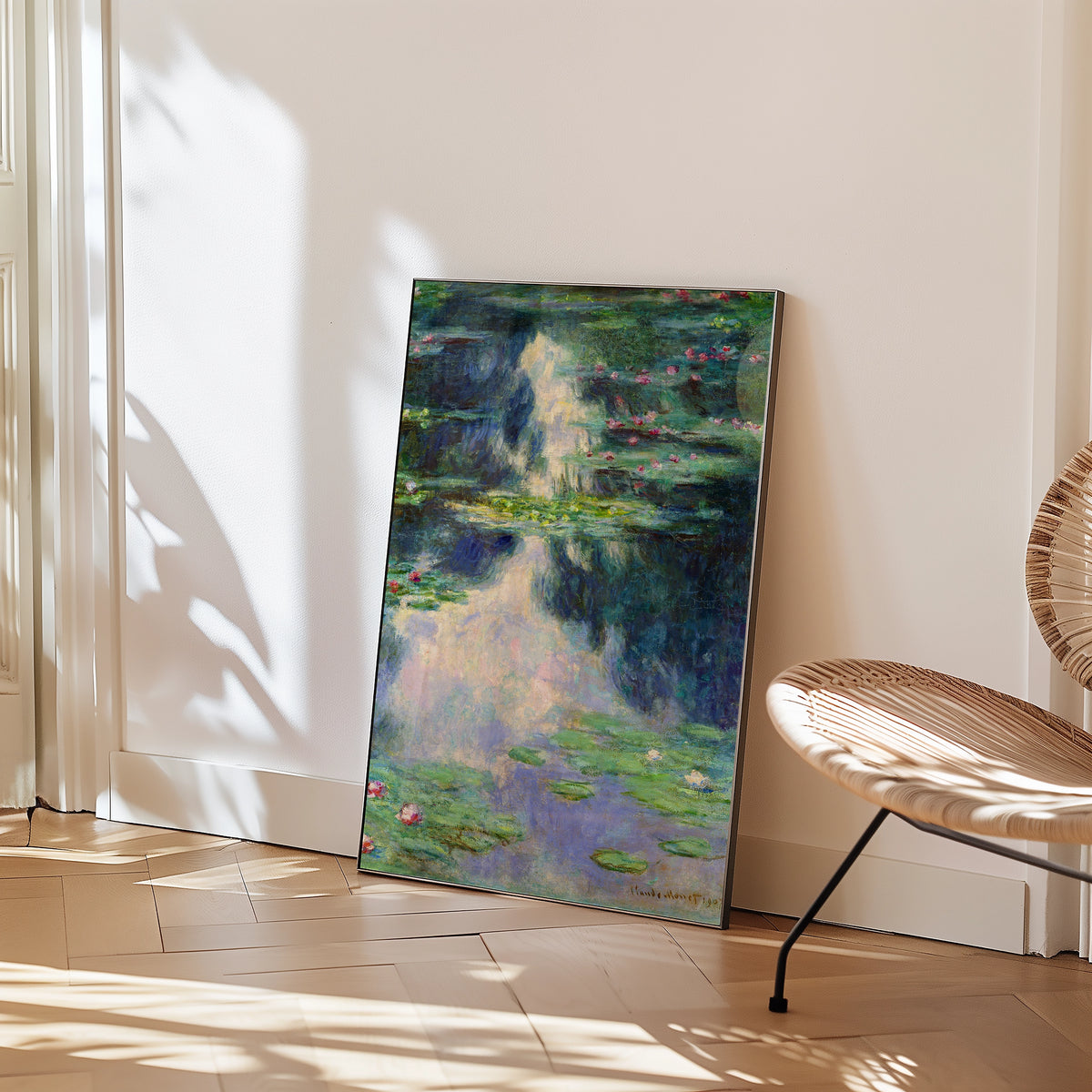 Painting of water lilies reflected in water, leaning against a wall in a modern interior setting.