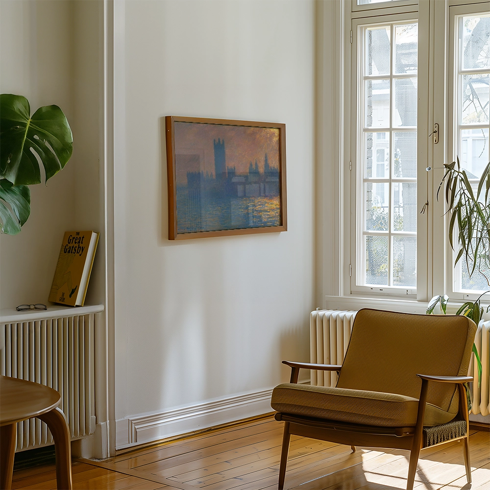 A beautifully framed painting of a city skyline hanging on a white wall, with a cozy chair and a plant in a well-lit living room.