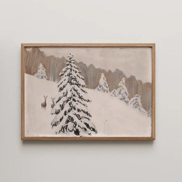 A serene winter landscape painting featuring snow-covered trees and two deer, framed in natural wood.