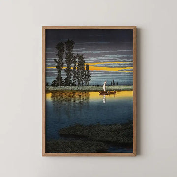 Framed painting of a serene landscape featuring a boat with a sail on calm water, surrounded by tall trees and a colorful sunset sky.