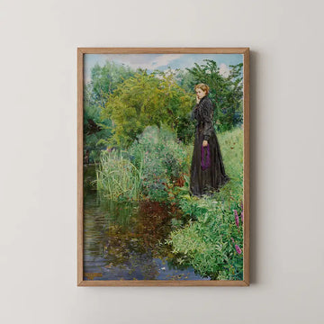 Painting of a woman in a black dress standing by a tranquil pond surrounded by lush greenery and colorful flowers, framed in natural wood.